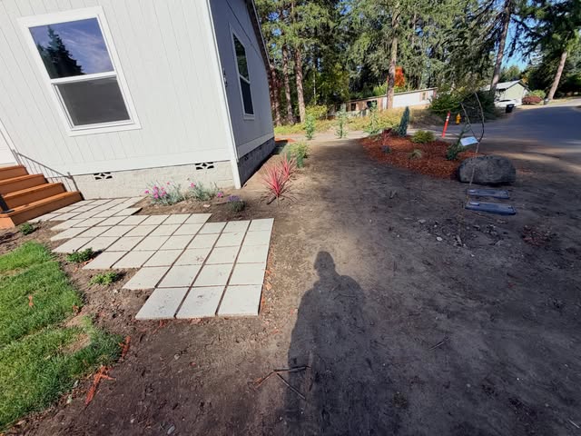 New paver path and planting beside a home